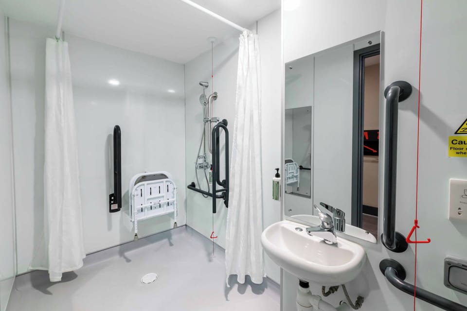 Accessible Double Room without window | Bathroom | Shower, eco-friendly toiletries, towels, soap