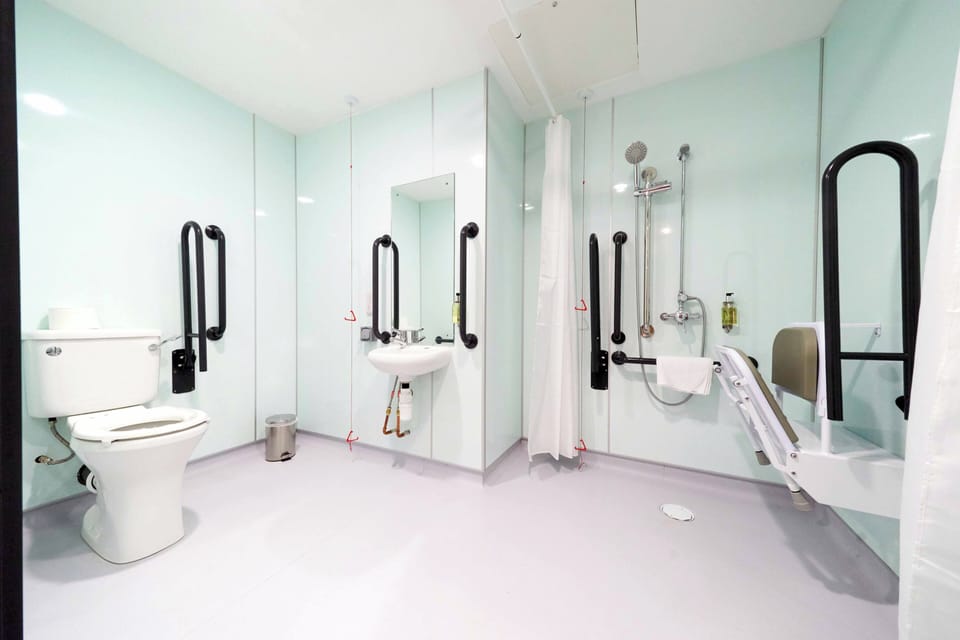 Accessible Double Room without window | Bathroom | Shower, eco-friendly toiletries, towels, soap