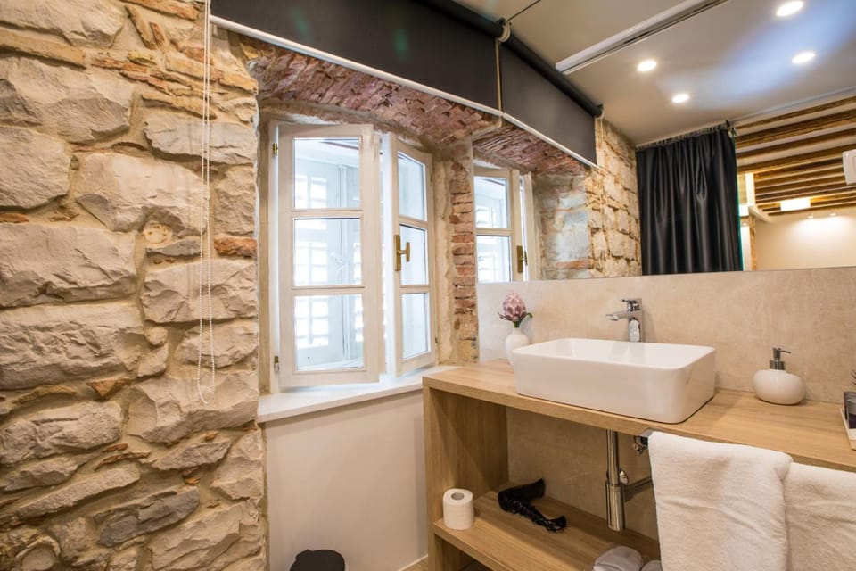 Shower, free toiletries, hair dryer, slippers