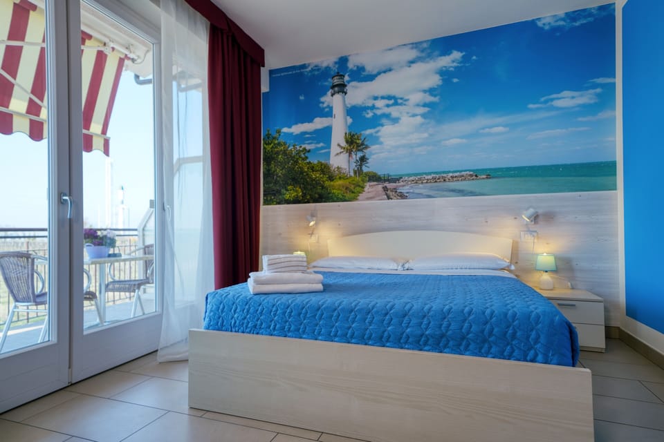 Double Room, Balcony, Partial Lake View | Minibar, in-room safe, individually decorated, desk