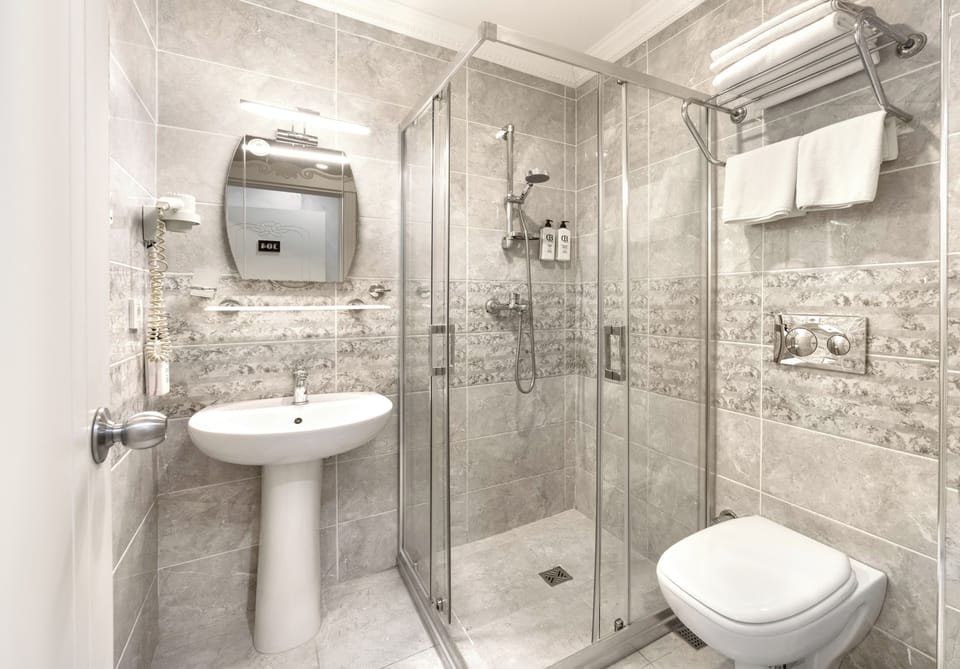 Shower, free toiletries, hair dryer, slippers
