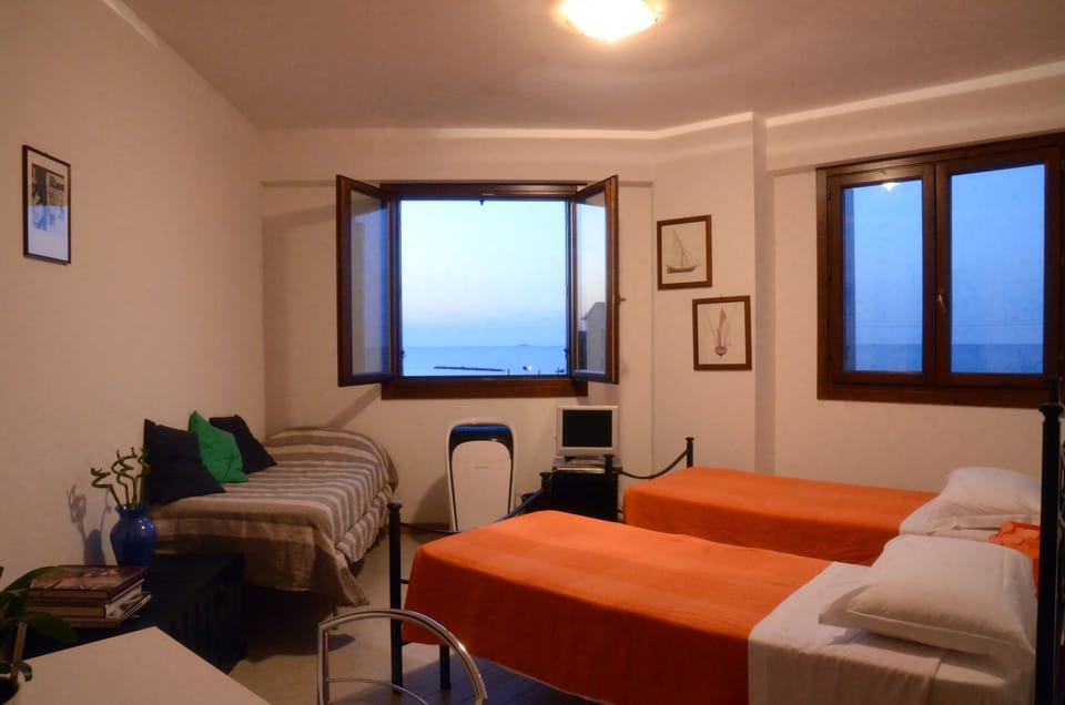 Triple Room, Private Bathroom | Minibar, desk, iron/ironing board, free WiFi