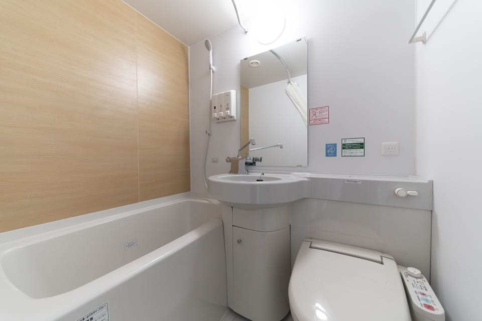 Separate tub and shower, free toiletries, hair dryer, slippers