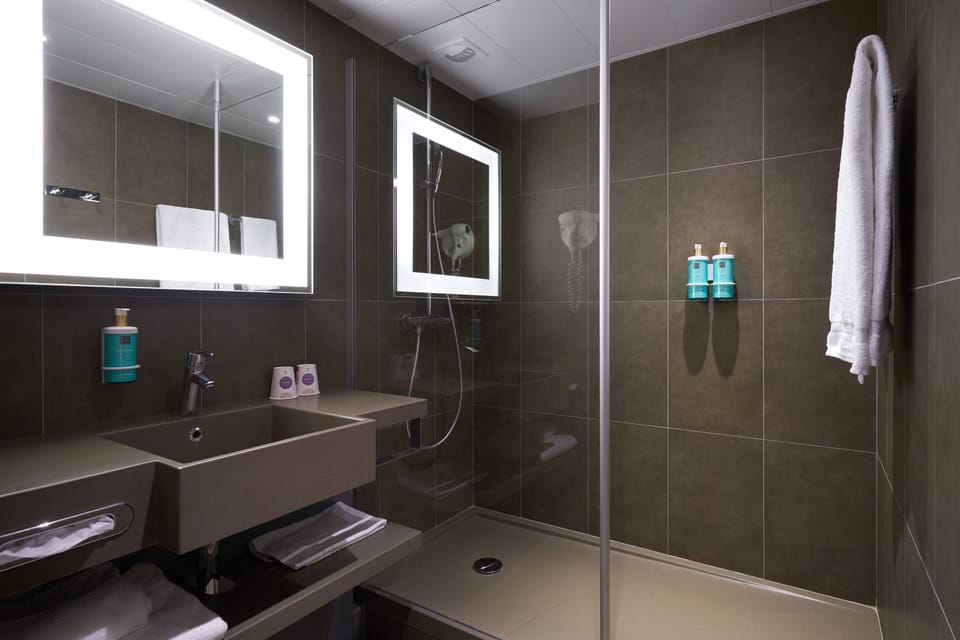 Designer toiletries, hair dryer, towels, soap