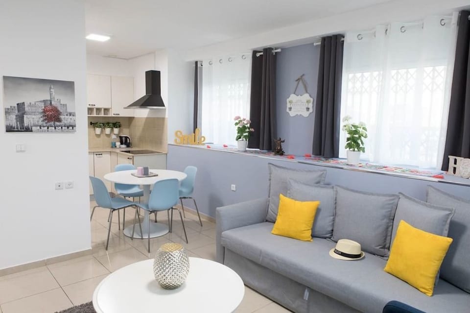 Apartment, City View | Living area | Flat-screen TV