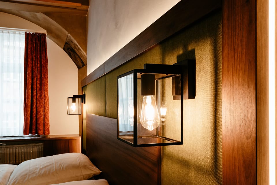 Comfort Quadruple Room, Multiple Beds | Living area | Flat-screen TV, books
