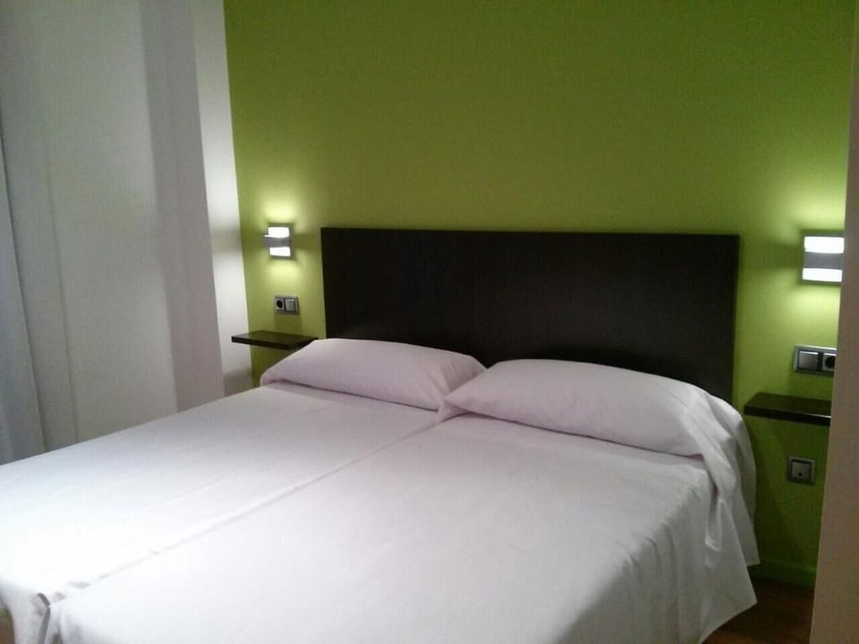 Premium bedding, desk, blackout drapes, soundproofing