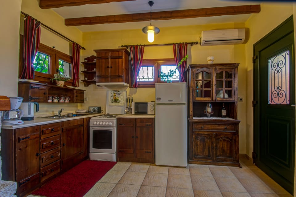 Apartment, 2 Bedrooms | Private kitchen | Coffee/tea maker, full-size fridge, oven, stovetop