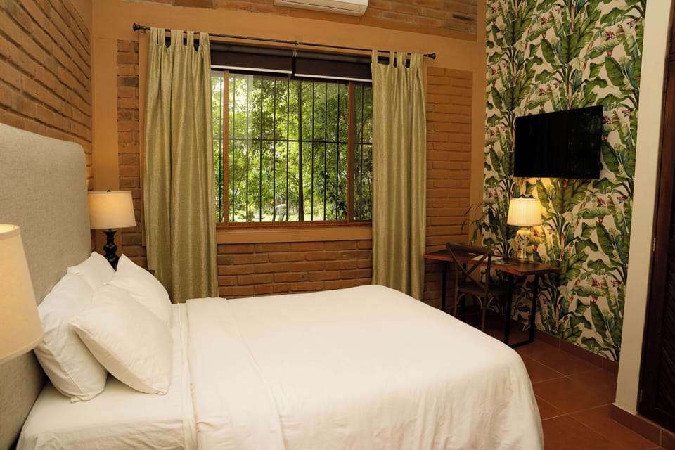 Deluxe Room, 1 Queen Bed | In-room safe, soundproofing, WiFi (free), bed sheets