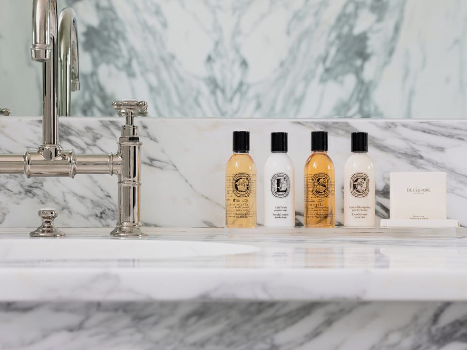 Designer toiletries, hair dryer, bathrobes, slippers