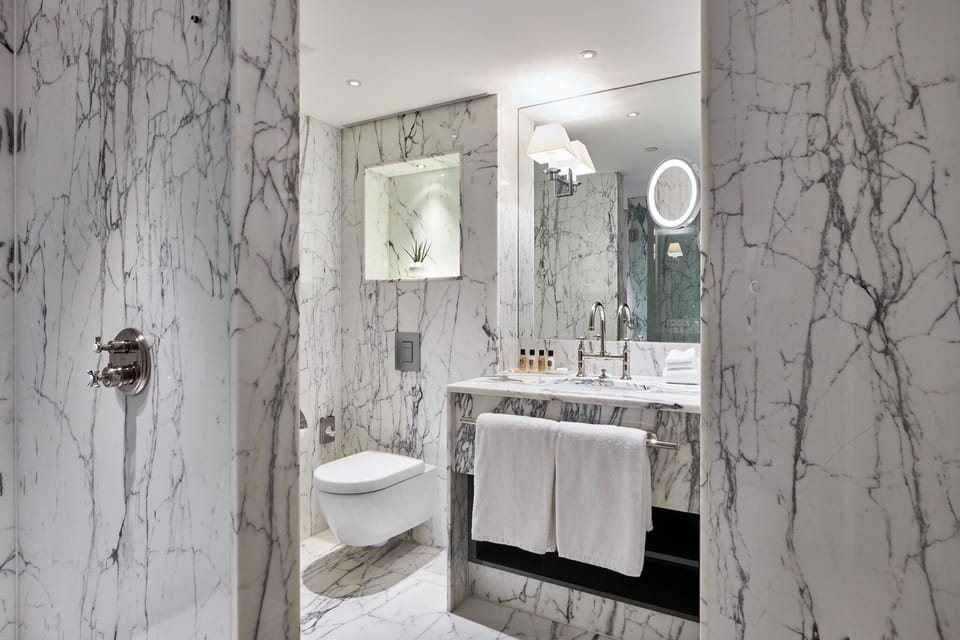 Designer toiletries, hair dryer, bathrobes, slippers