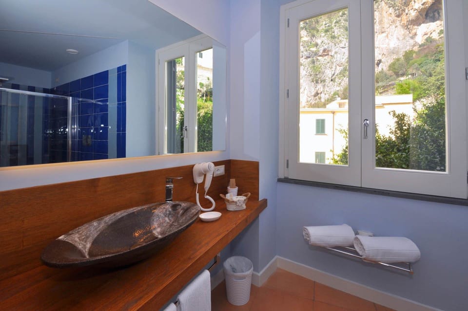 Superior Triple Room, 1 Bedroom | Bathroom | Shower, deep soaking tub, free toiletries, hair dryer