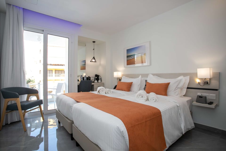 Memory foam beds, free minibar items, in-room safe
