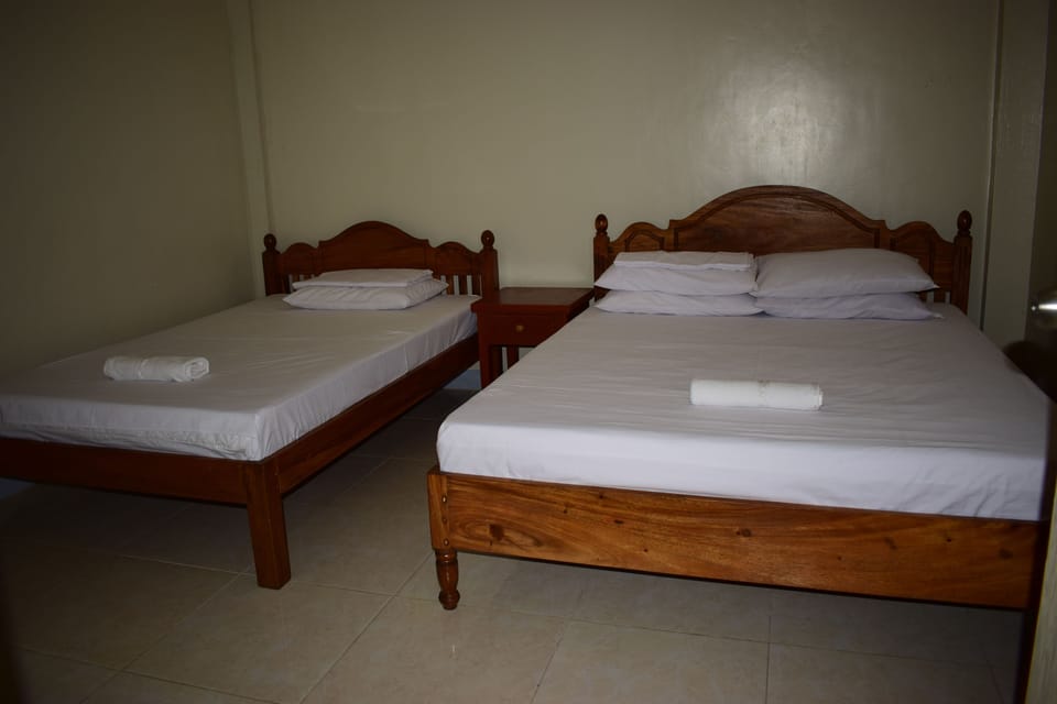 Deluxe Quadruple Room, Multiple Beds, Kitchen | Room amenity