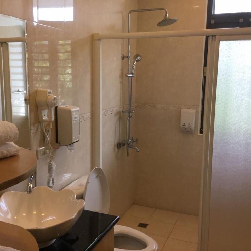 Shower, free toiletries, hair dryer, slippers