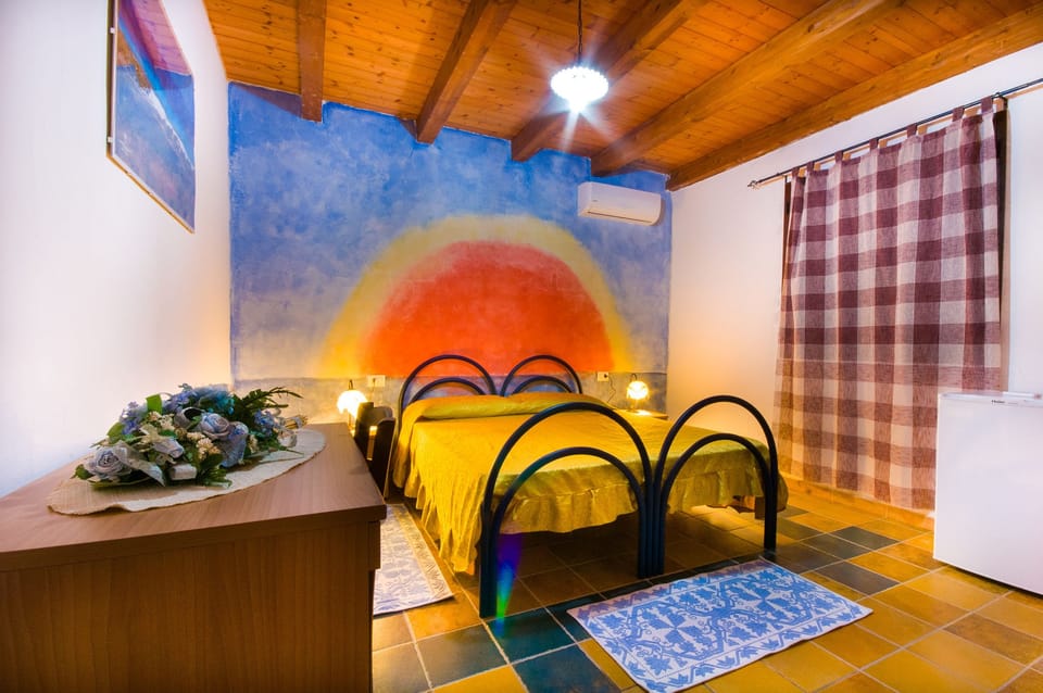 Quadruple Room, Garden View | Minibar, free WiFi, bed sheets