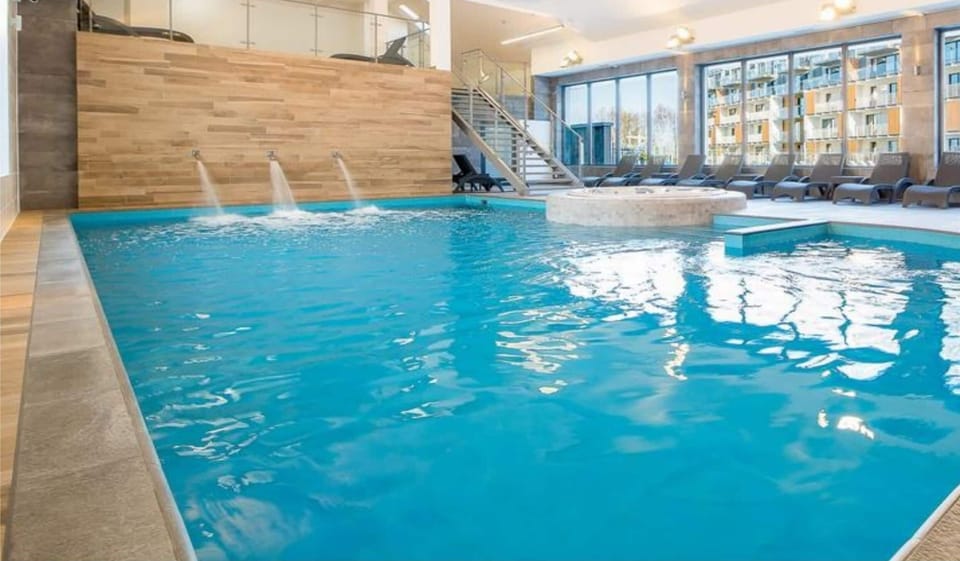 Indoor pool, seasonal outdoor pool, pool umbrellas, sun loungers