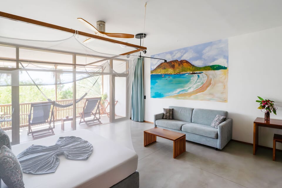 Deluxe Double Room, Partial Sea View | Minibar, in-room safe, WiFi (free), bed sheets