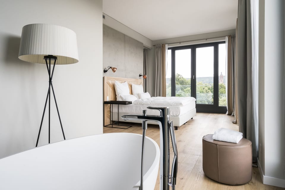FREIblick Suite | Hypo-allergenic bedding, minibar, in-room safe, blackout drapes