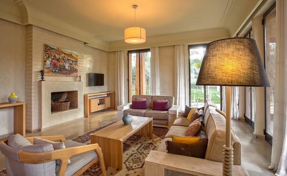 Luxury Villa, Pool View (3 Suites Luxe) | Living room | 32-inch flat-screen TV with cable channels, TV, fireplace