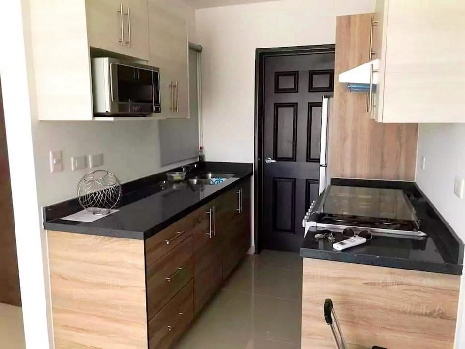 Family Condo, 2 Bedrooms | Private kitchen | Fridge, microwave, stovetop, cookware/dishes/utensils