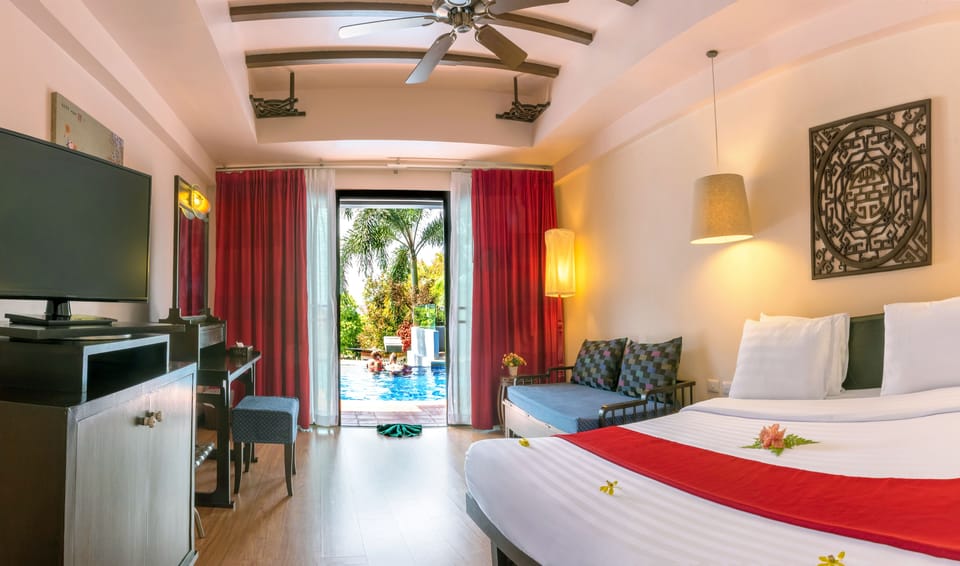 Deluxe Room, Pool Access | Minibar, in-room safe, desk, soundproofing