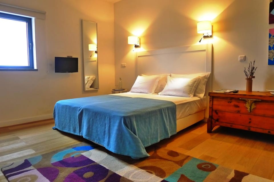 Desk, blackout drapes, iron/ironing board, bed sheets