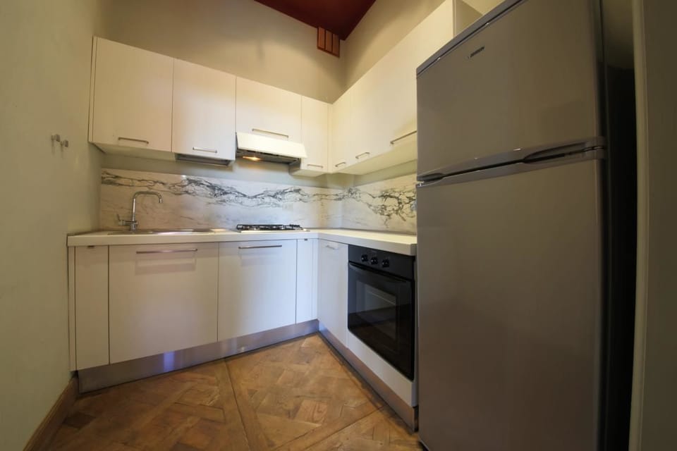 Apartment, 2 Bedrooms | Private kitchen | Full-size fridge, stovetop, cookware/dishes/utensils