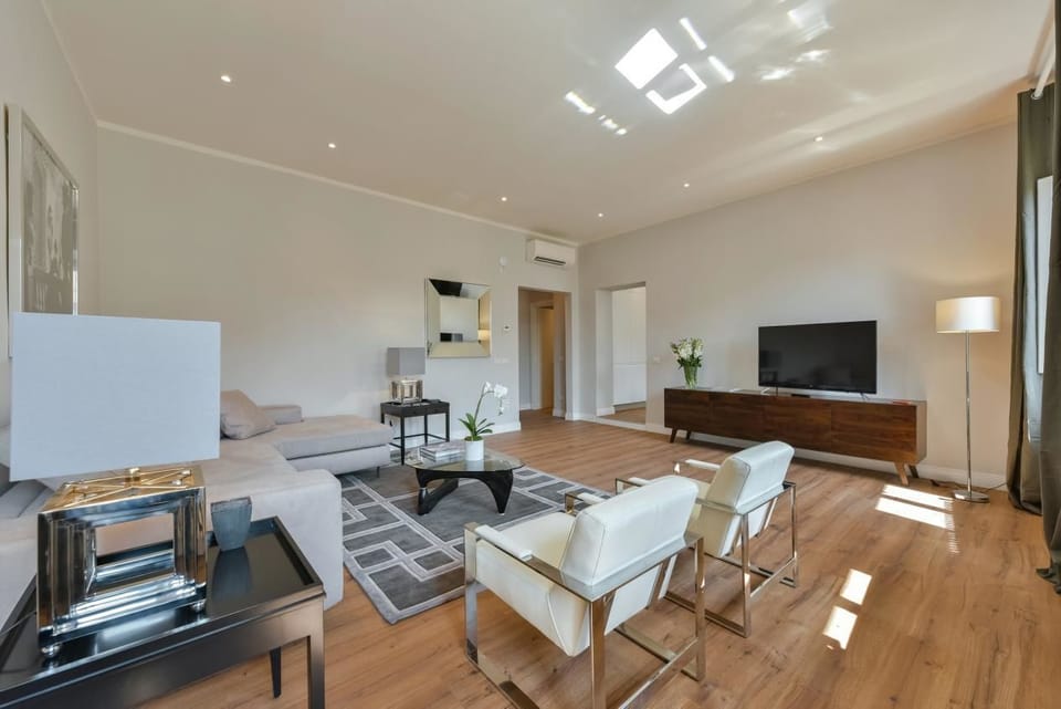 Apartment, 4 Bedrooms | Living room | Flat-screen TV