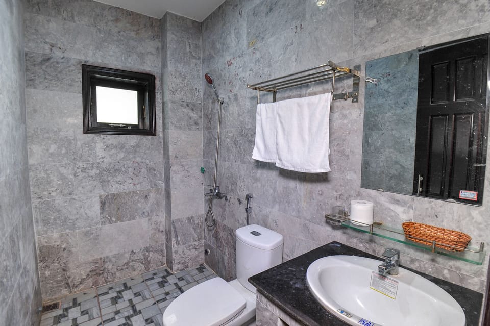 Shower, free toiletries, hair dryer, slippers