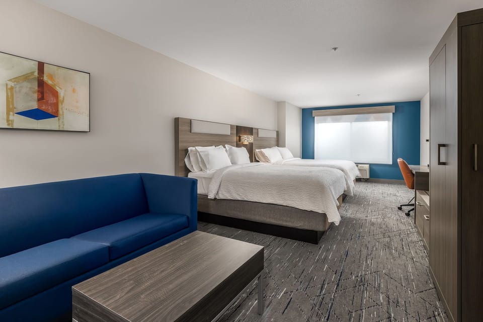 Suite, 2 Queen Beds | In-room safe, desk, iron/ironing board, free cribs/infant beds