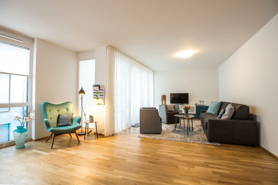 Deluxe Apartment | Living area | Flat-screen TV