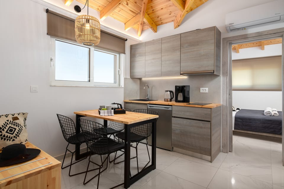 Family Suite, Multiple Bedrooms, 2 Bathrooms | Private kitchen | Fridge, stovetop, electric kettle, toaster