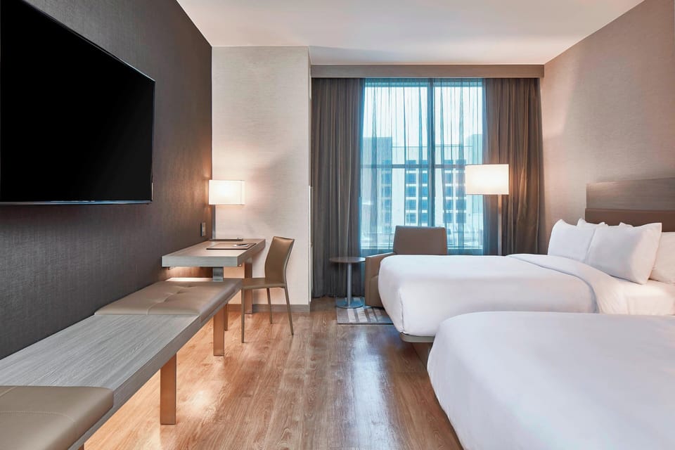 Premium bedding, desk, laptop workspace, iron/ironing board