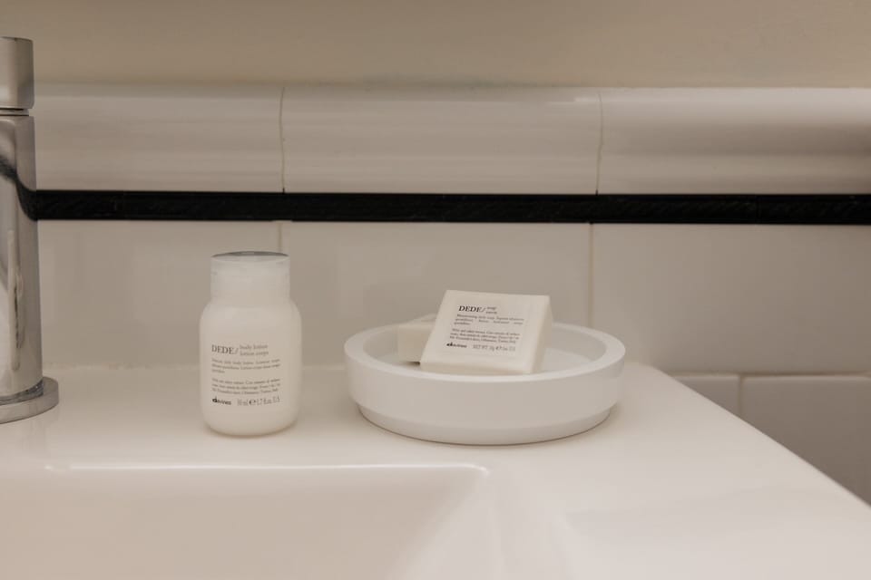 Deep soaking tub, designer toiletries, hair dryer, towels