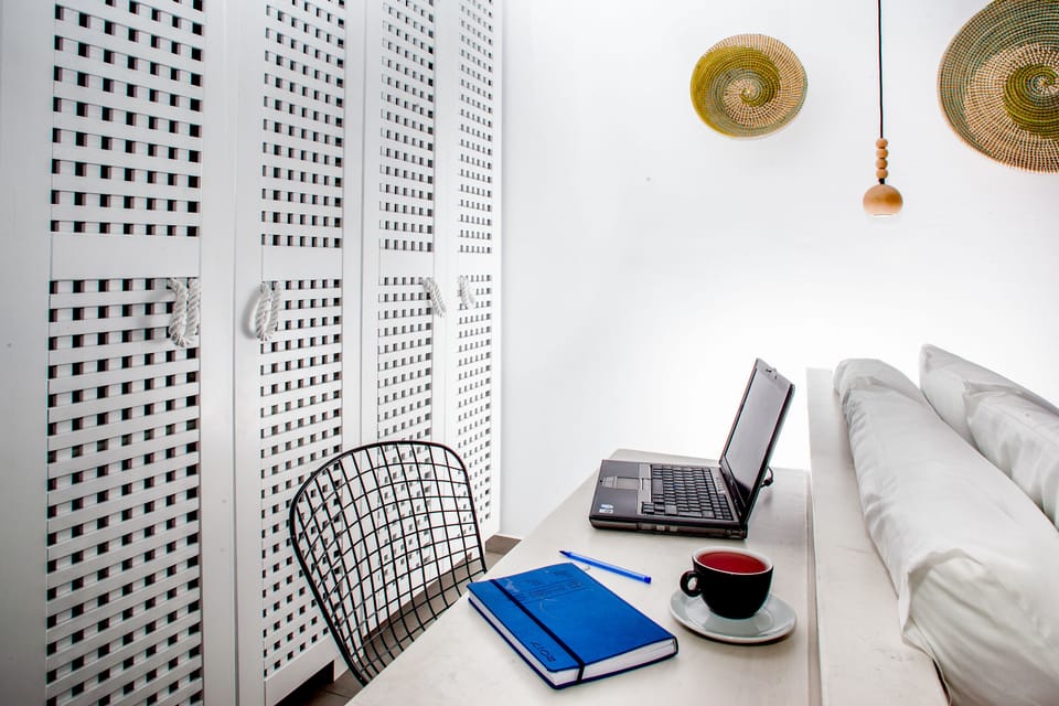 Senior Double Room | Living area | Flat-screen TV