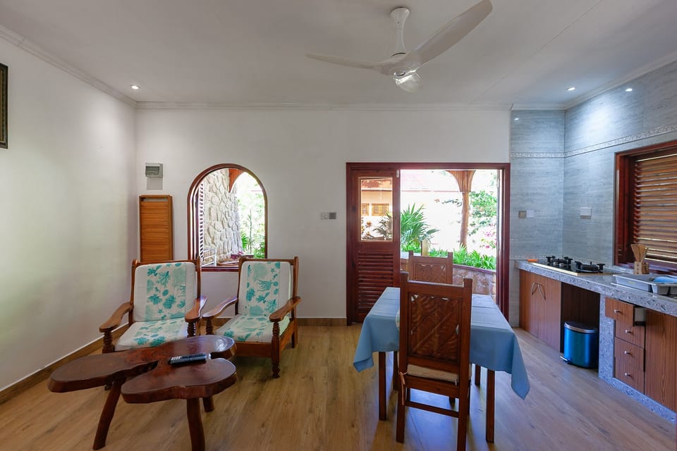 Deluxe Apartment, 1 Queen Bed | Living area | 32-inch flat-screen TV with cable channels, TV