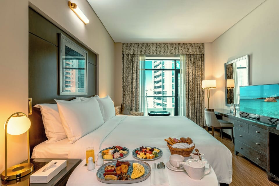Deluxe King | Premium bedding, in-room safe, laptop workspace, blackout drapes