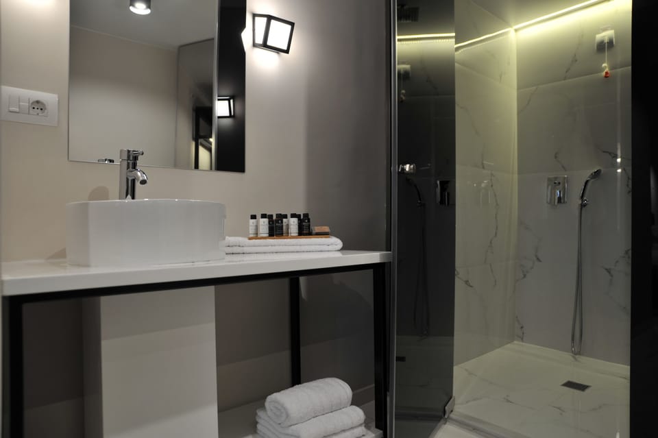 Shower, eco-friendly toiletries, hair dryer, slippers
