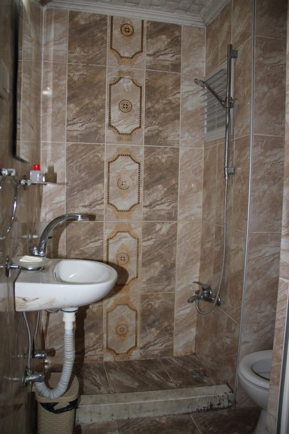 Shower, free toiletries, hair dryer, slippers