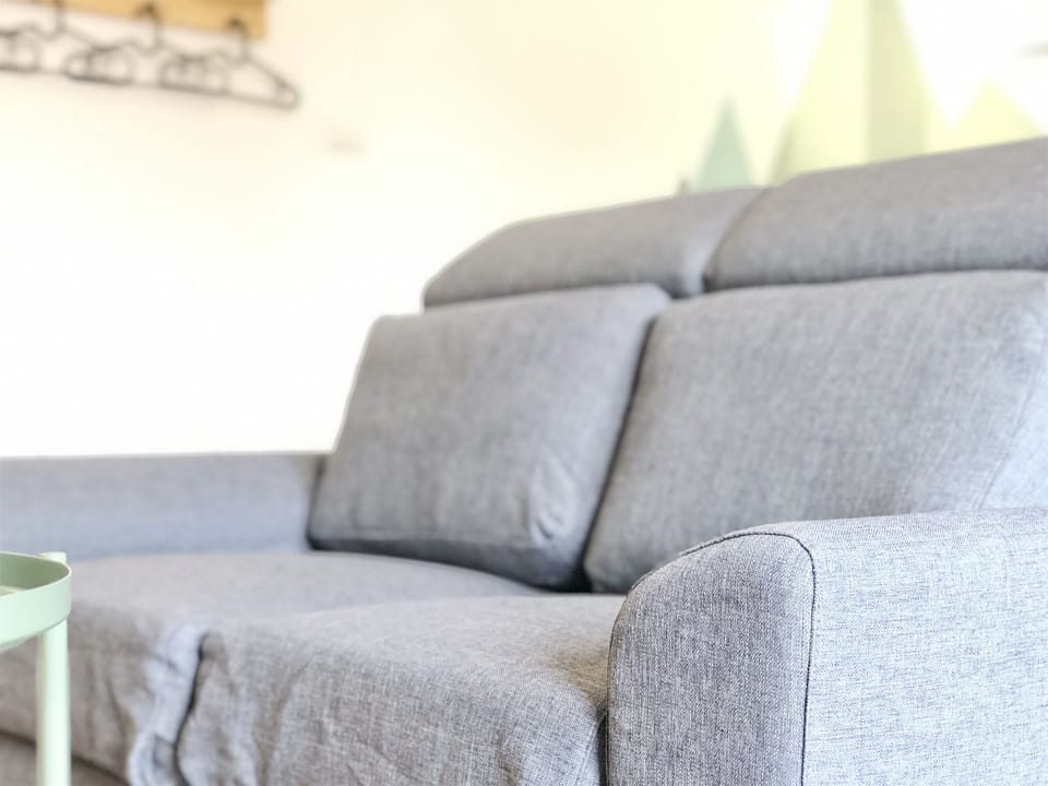 Gallery Quadruple Room, 1 Bedroom | Living area | Flat-screen TV