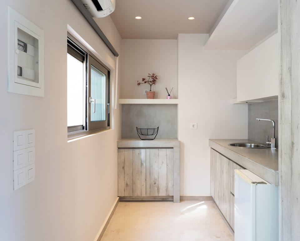Deluxe Family Suite With Sea View | Living area | Flat-screen TV, printers