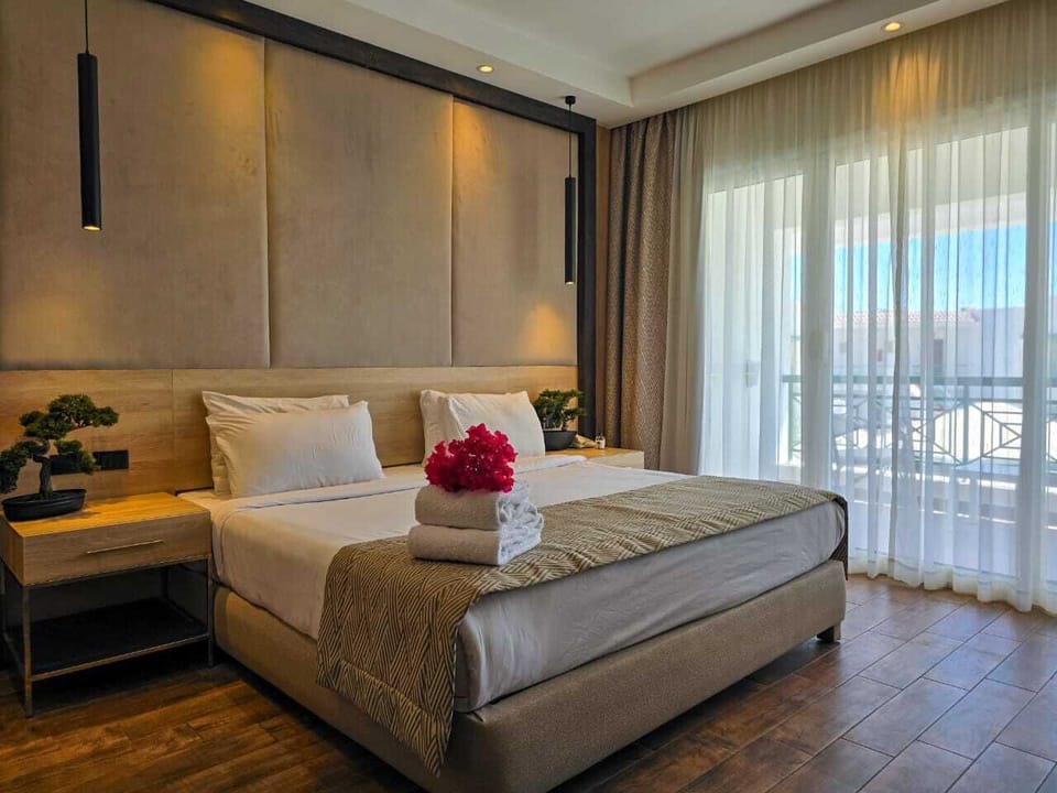 Deluxe Double or Twin Room, Pool View | Free minibar items, in-room safe, blackout drapes, iron/ironing board