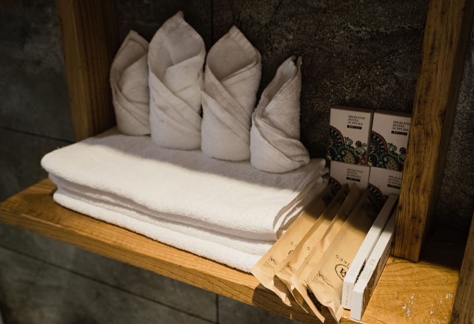 Suite, 2 Bedrooms | Bathroom | Rainfall showerhead, hair dryer, slippers, towels