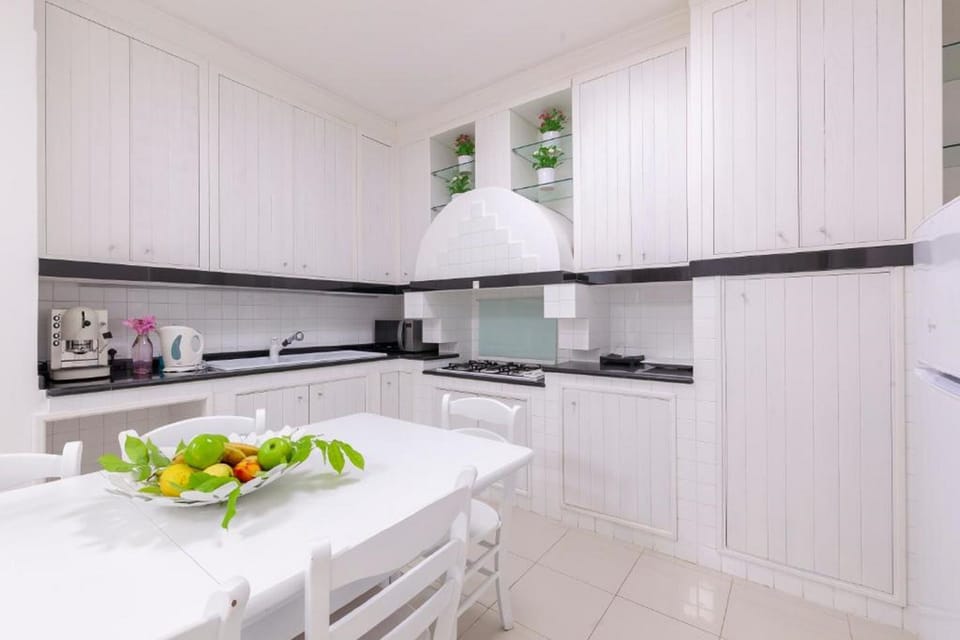 Deluxe Suite, Hot Tub | Private kitchen | Fridge, coffee/tea maker, electric kettle