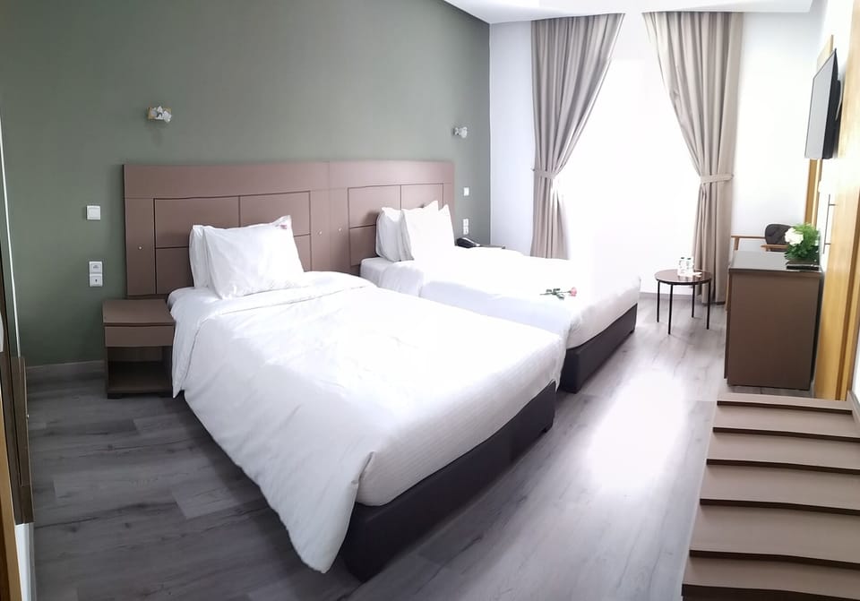 Twin Room | Minibar, individually furnished, desk, laptop workspace