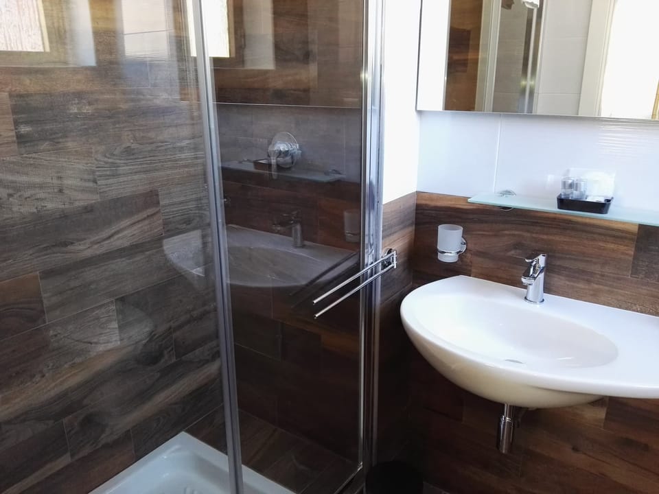 Shower, deep soaking tub, free toiletries, hair dryer