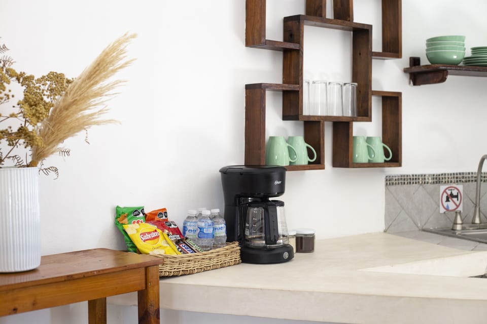 Junior Suite | Private kitchen | Full-size fridge, microwave, stovetop, coffee/tea maker