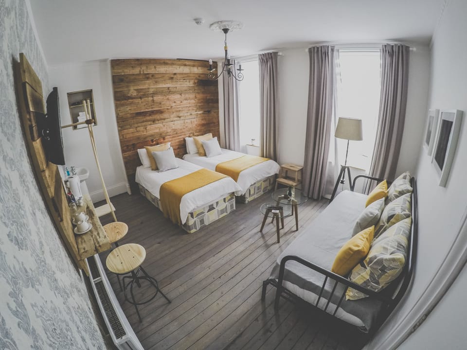 Standard Triple Room, 2 Twin Beds, Shared Bathroom | Individually decorated, individually furnished, blackout drapes