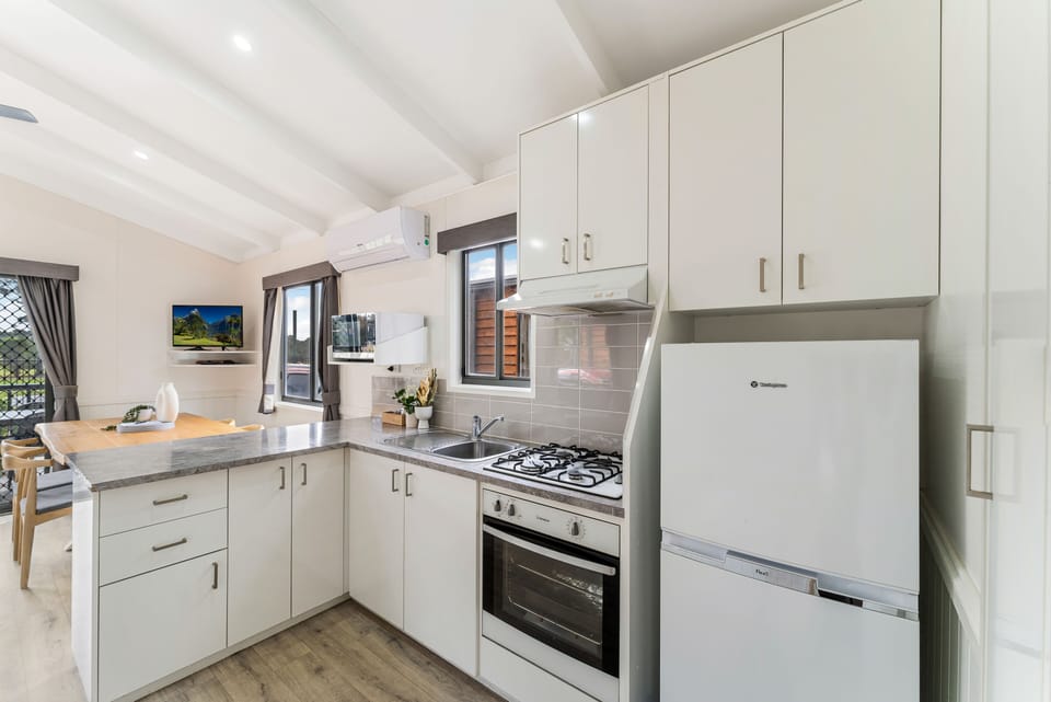 Deluxe Three Bedroom Cabin (with balcony) | Private kitchen | Full-size fridge, microwave, oven, stovetop